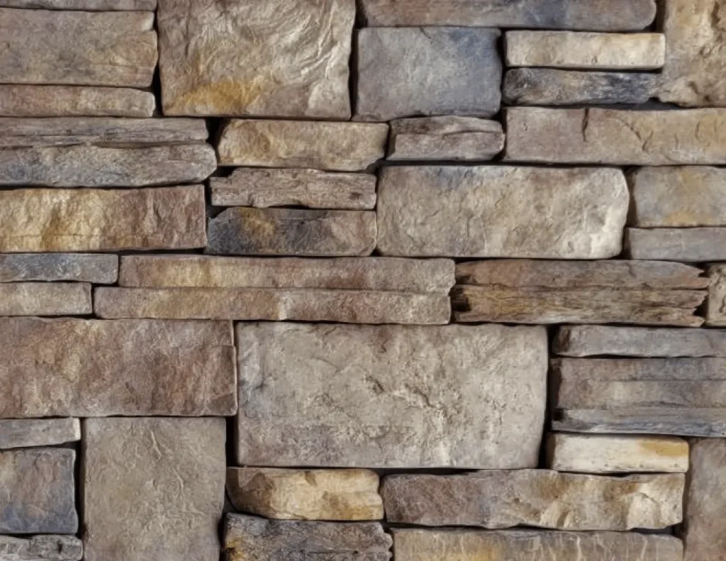 California-Blend-Carmel A close-up of a wall made from rectangular, stacked, tan and gray stone bricks.