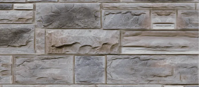 Castlerock-Quartz Gray and beige rectangular stone bricks arranged in a staggered pattern on a wall.