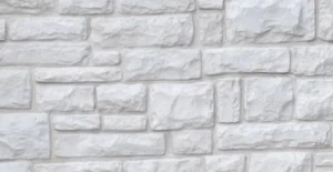 Light gray stone brick wall with an irregular rectangular pattern and a rough textured surface.