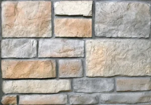 Rectangular beige and gray stone bricks arranged in a staggered horizontal pattern on a wall.