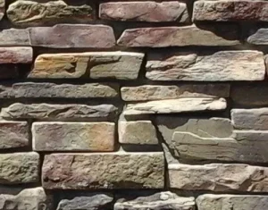 Rough, multicolored stone bricks arranged in a horizontal stacked pattern on a wall.