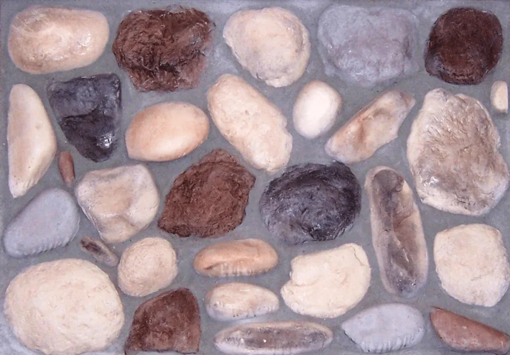 River-Rock-Lake-Superior Assorted smooth stones in various colors set in gray cement, arranged in a rectangular pattern.