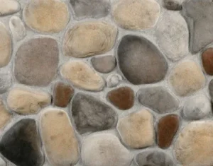 A close-up view of a wall made of smooth, multicolored, natural river stones set in mortar.