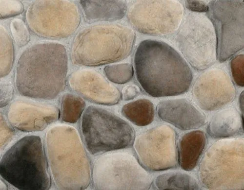 River-Rock-Mississippi A close-up view of a wall made of smooth, multicolored, natural river stones set in mortar.